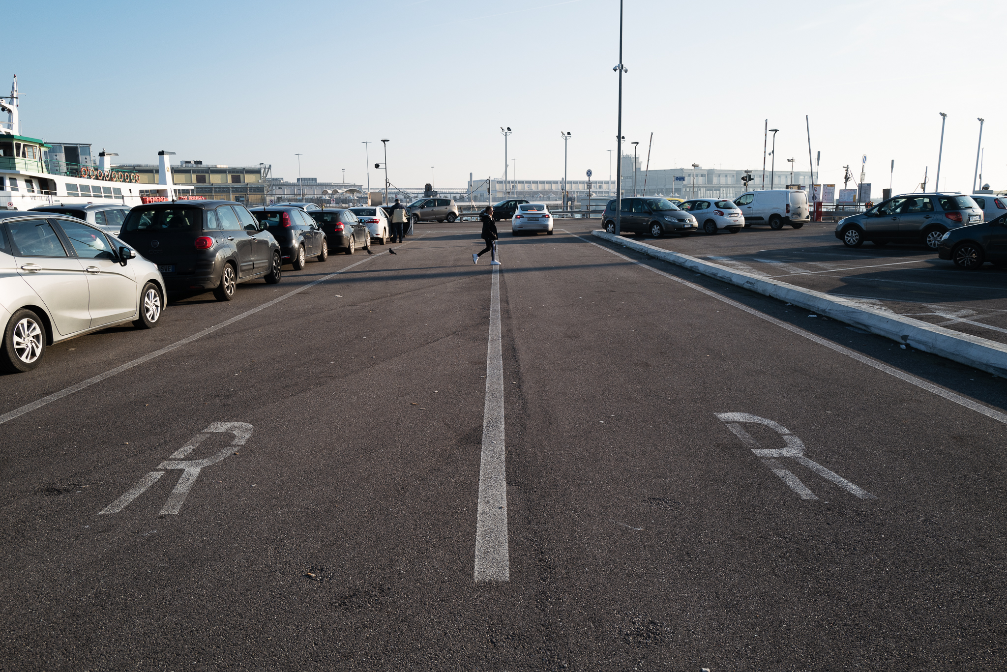 Two full rows of queueing cards while the Tesla is standing alone in one of the reservation lanes.